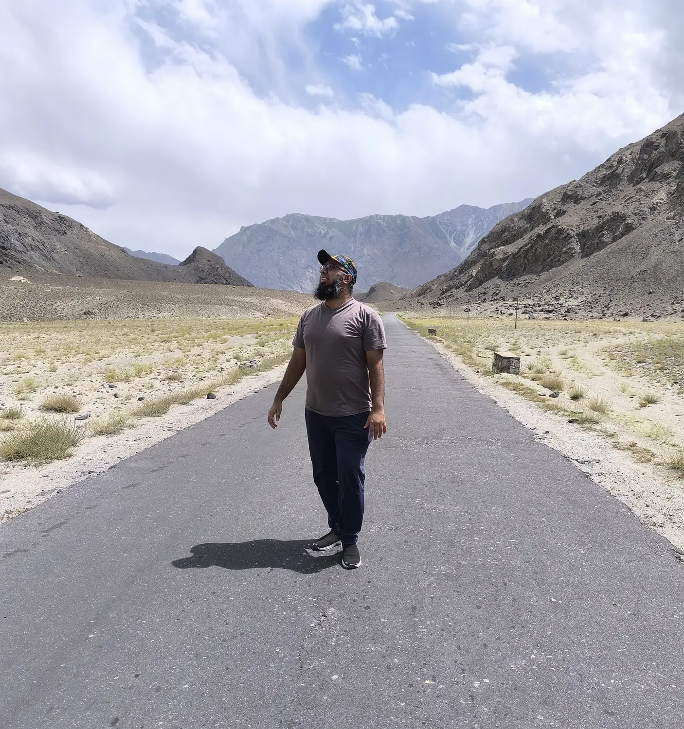 An empty road running into the Karakoram mountains near Skardu, Pakistan